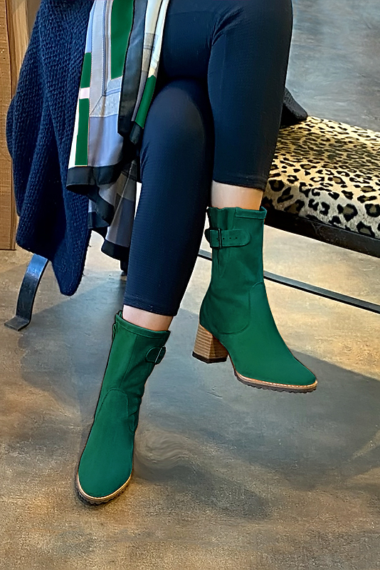 Emerald green women's ankle boots with buckles on the sides. Round toe. Medium block heels. Worn view - Florence KOOIJMAN